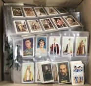 A large quantity of cigarette cards on t