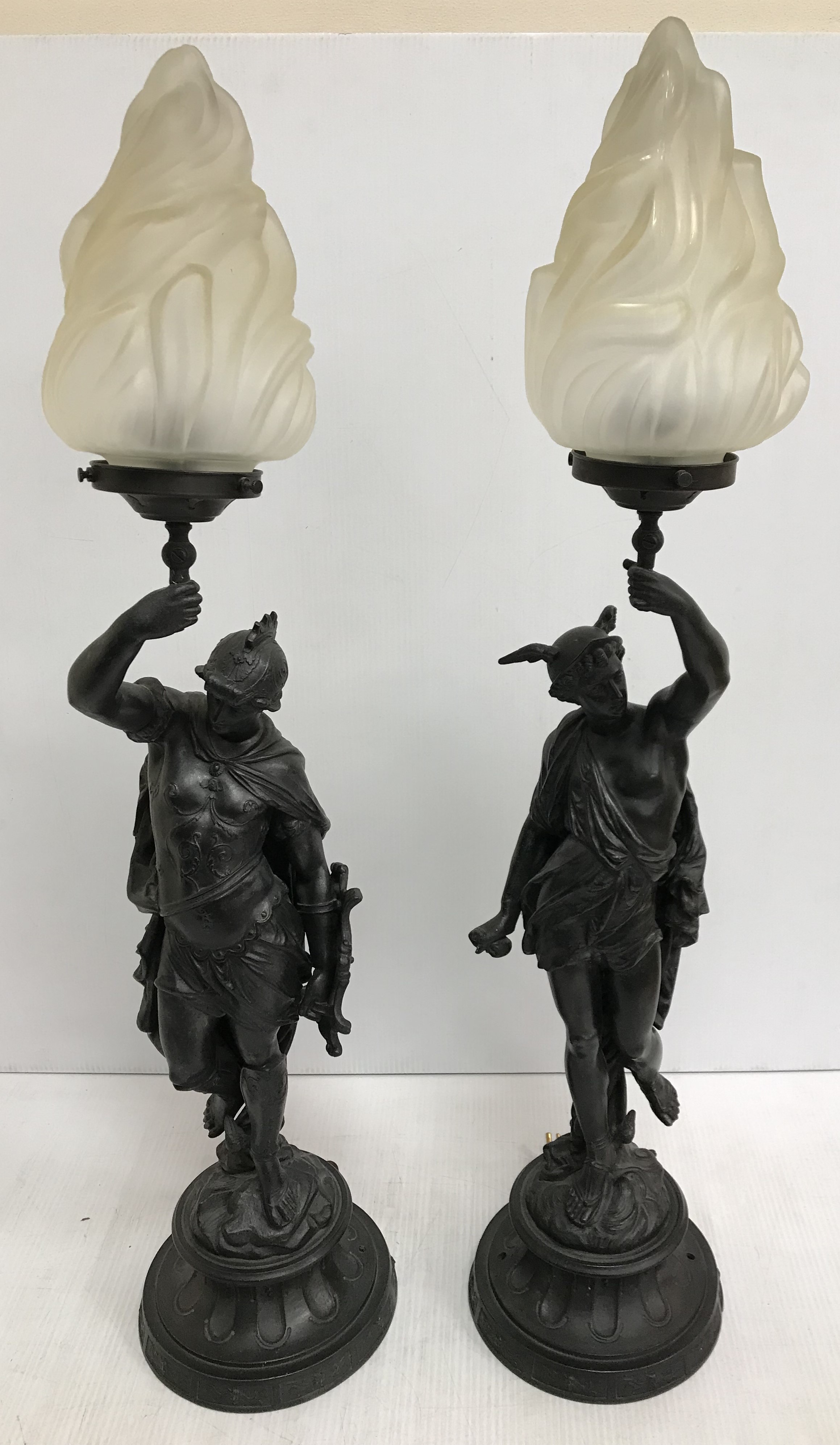 A pair of patinated spelter figural lamp