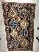 A Caucasian rug, the central panel set w