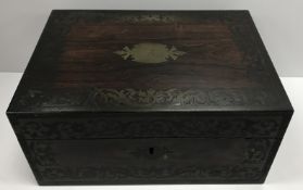 A 19th Century rosewood and brass inlaid