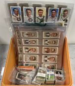 A collection of cigarette cards depictin