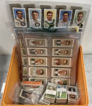 A collection of cigarette cards depictin