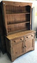 A pine dresser, the two tier boarded pla