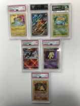 A collection of Pokemon cards, including