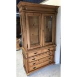 A modern pine china display cabinet with