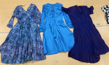 A box containing seven vintage dresses c