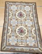 A needlepoint rug / panel, the central p