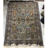 A silk rug, the central panel set with t