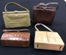 Four circa 1950s crocodile skin handbags