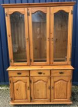 A modern pine dresser, the three glazed