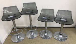 A set of four Italian smoked acrylic and chrome rise and fall bar stools, 71.5 cm high min / 98.
