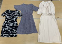 A box containing six various dresses com