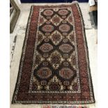 A Belouch rug, the central panel set wit