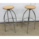 A pair of Merak plywood seated stools on