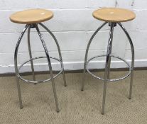 A pair of Merak plywood seated stools on