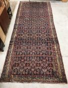A vintage Persian carpet, the central pa