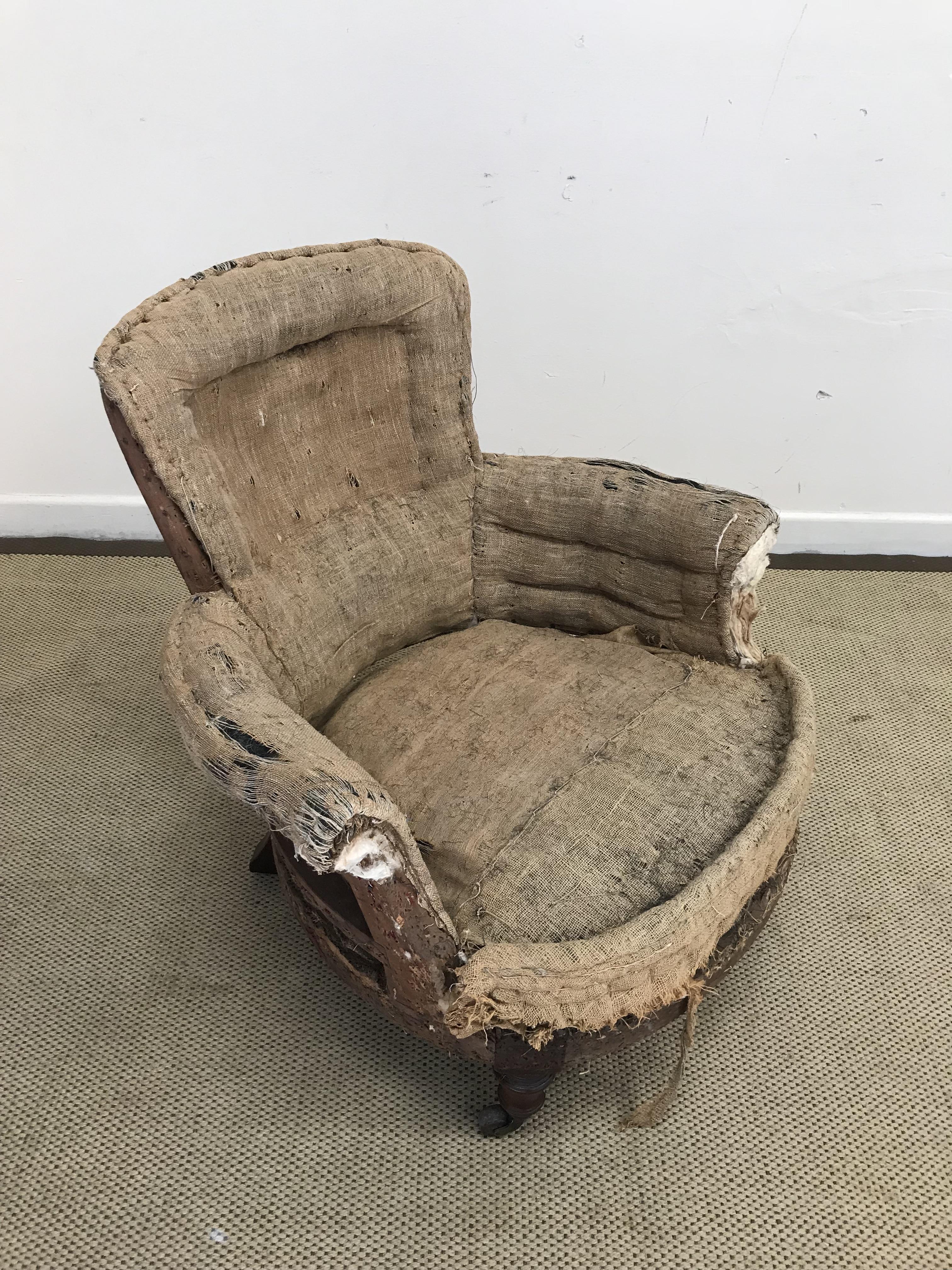 A Victorian scroll arm low salon chair o