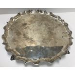 A George II silver salver with pie crust