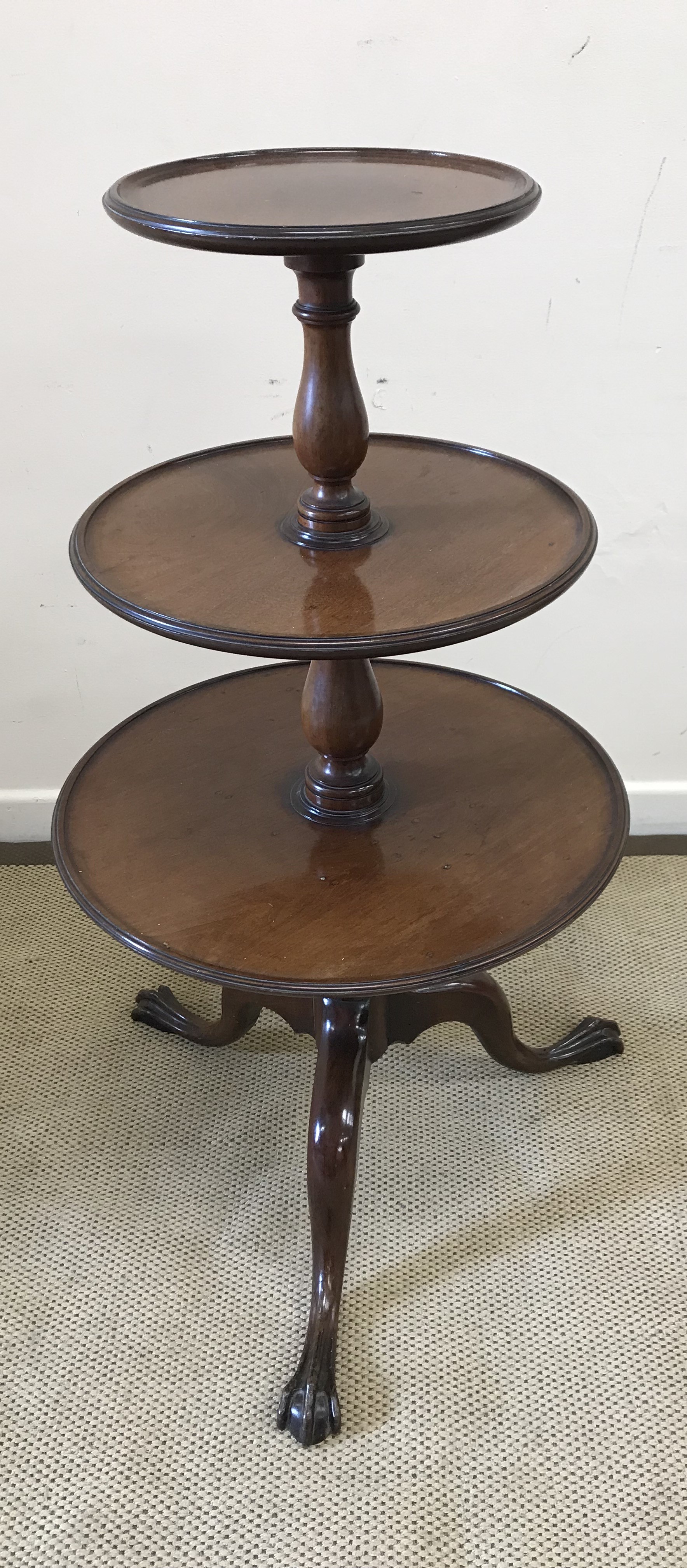 A circa 1900 mahogany dumb waiter in the