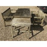 A slatted teak garden table of rectangul