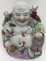 A Chinese polychrome decorated figure of