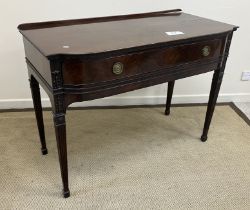 An Edwardian mahogany serving table in t