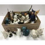 A collection of cat figures to include v
