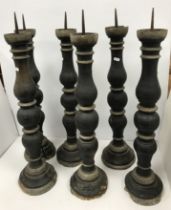 A set of black painted and gilded treenw