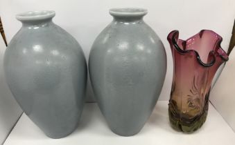 A pair of mottled blue grey glazed vases