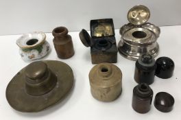 A collection of eight various inkwells including a George V silver example (by Henry Williamson Ltd,
