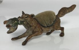 A circa 1900 Austrian cold painted bronze pin cushion as a fox with mallard drake prey in the