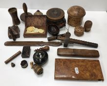 A collection of small treenware items to include a circular lignum vitae six place coaster set,