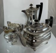 An Elizabeth II silver tea set of rounded rectangular form,