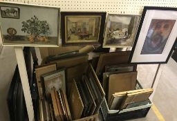 A large collection of assorted decorative pictures, prints, art portfolios, etc.