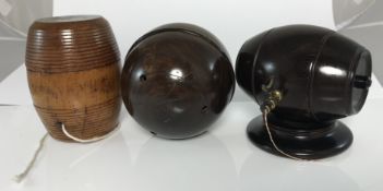 A 19th Century lignum vitae string box of barrel form with brass tap and string cutter surmount