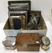 A box containing 17 various photograph frames, a plated on copper tea caddy,