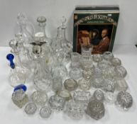 A collection of glass decanters to include a Holmegaard 'Gluck Gluck' decanter of leaning form with