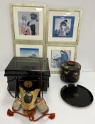 A modern Japanese samurai model helmet in a lacquered case, approx.