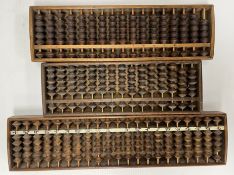 Three Japanese abacuses, one with bone script panel to front, 46.5 cm long x 11.