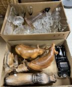 Two boxes of assorted sundry household items to include various treenware animals,