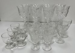 A set of eight Galway cut crystal wines together with a selection of cut glass liqueur glasses,