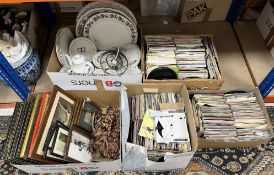 Three boxes containing assorted 45s together with a box containing assorted prints to include a set