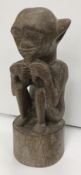 A 1950s Malaysian carved teak figure of