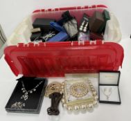 A box of various costume jewellery inclu