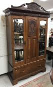 A late Victorian walnut wardrobe, the br