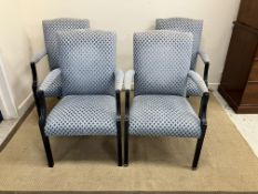 A set of four modern upholstered and ebo