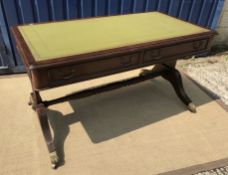 A reproduction mahogany library table in