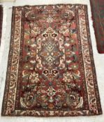 A Persian design rug, the central panel