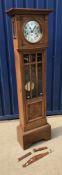 A 1930s oak cased long case clock, the t