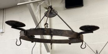 A pair of wrought iron electroliers of p